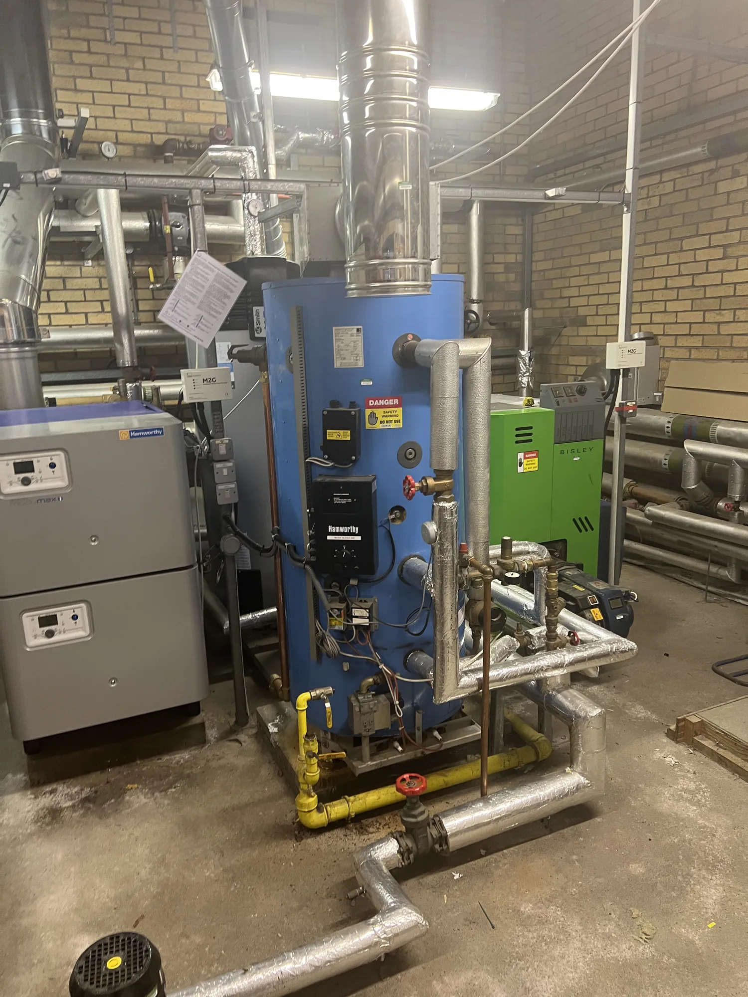 Commercial water heater and pipework installed by Sensible Building Services
