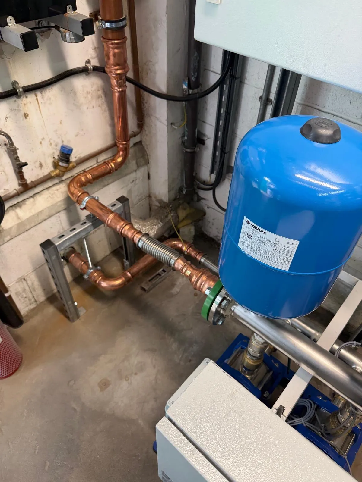 Adjusted copper supply pipework feeding the new booster set in Grangemouth