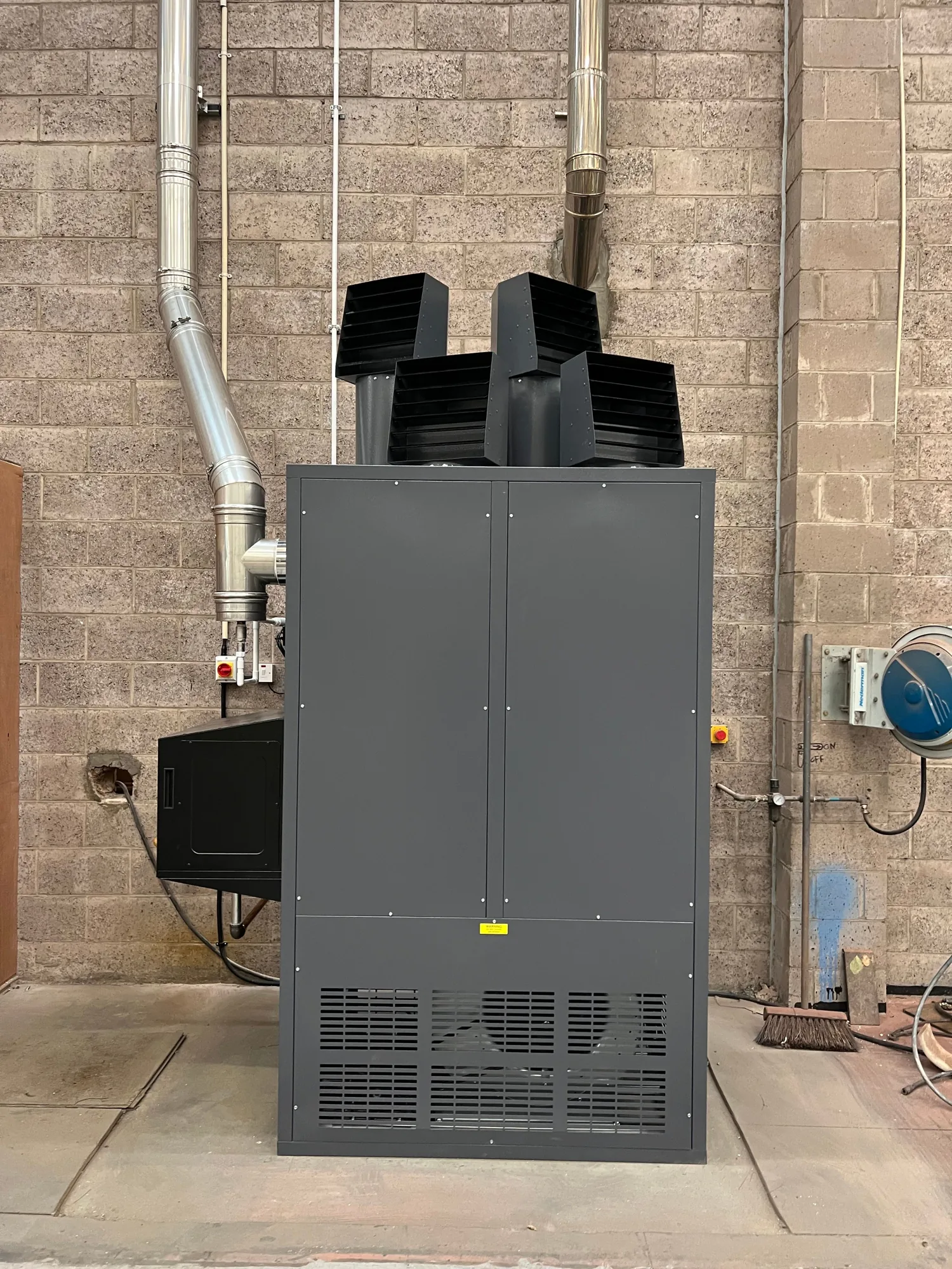 The new Powrmatic CX 175 kW warm air cabinet heater installed and commissioned