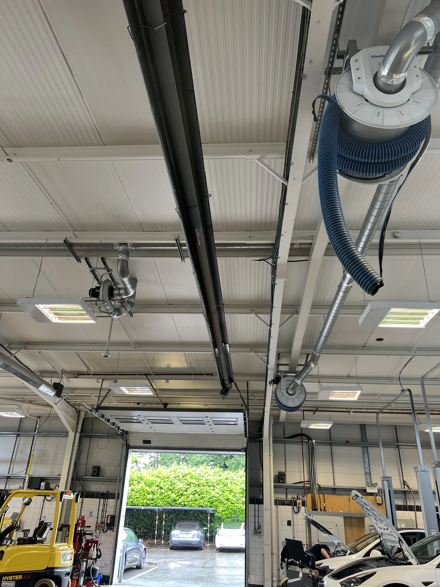 Vehicle exhaust extraction ductwork in a workshop